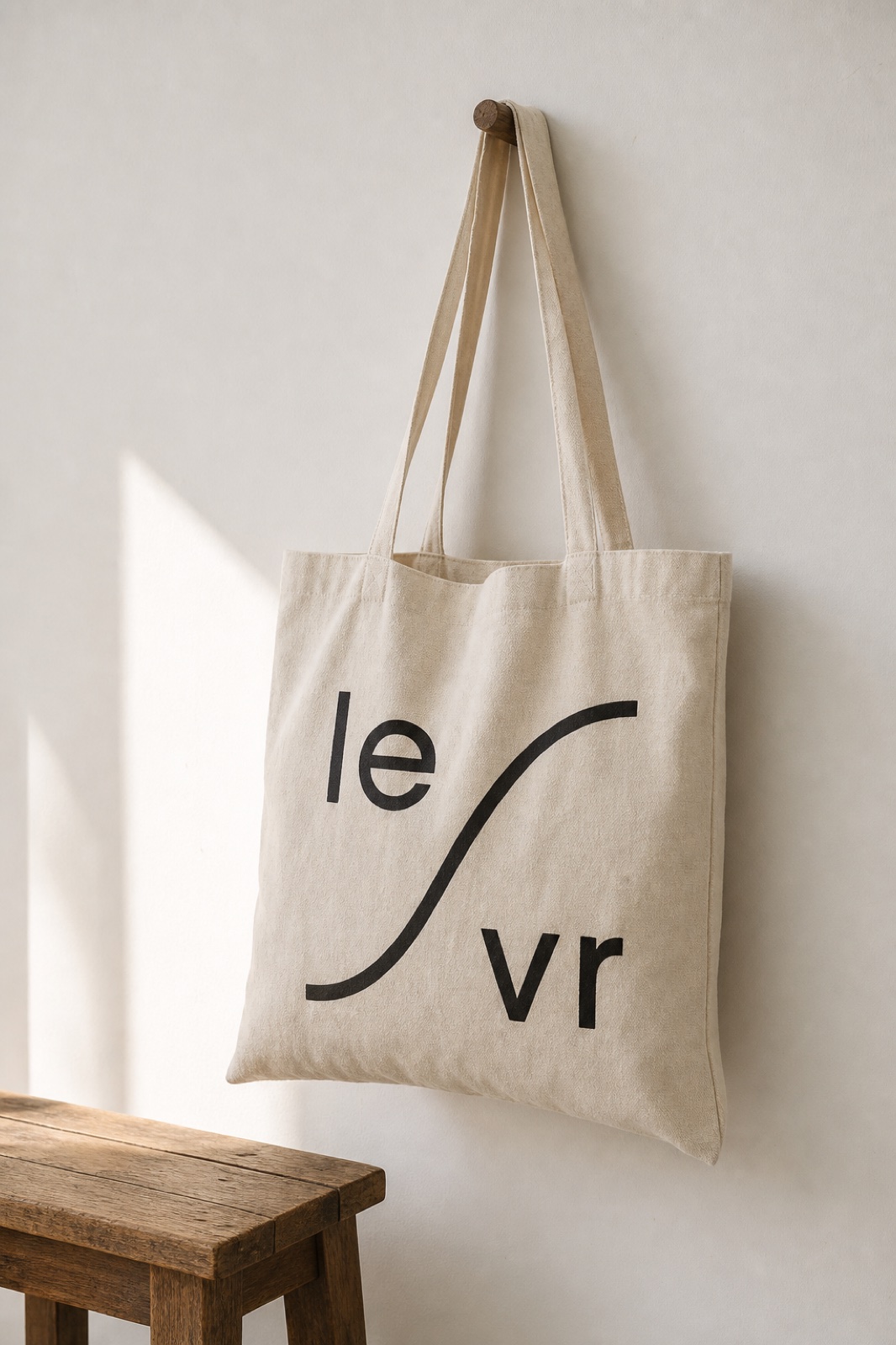 LEVR mark screen-printed on a canvas tote.