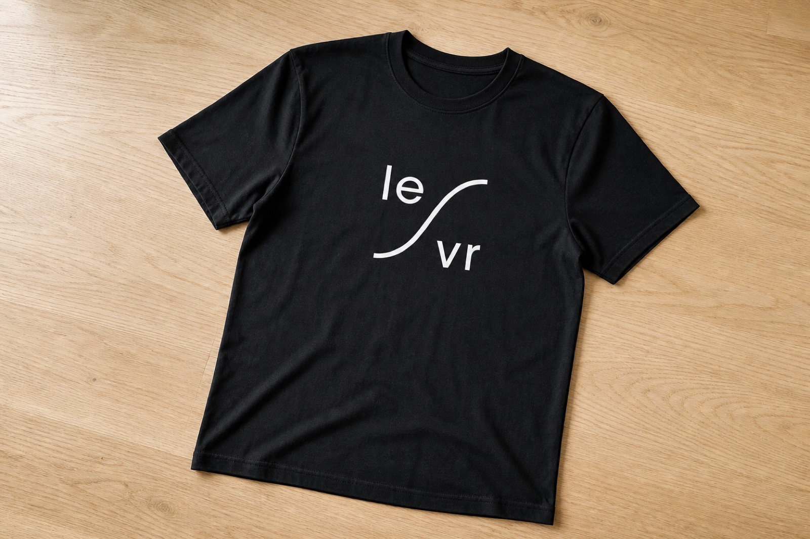 White LEVR mark on a black tee, single-color reversed print.